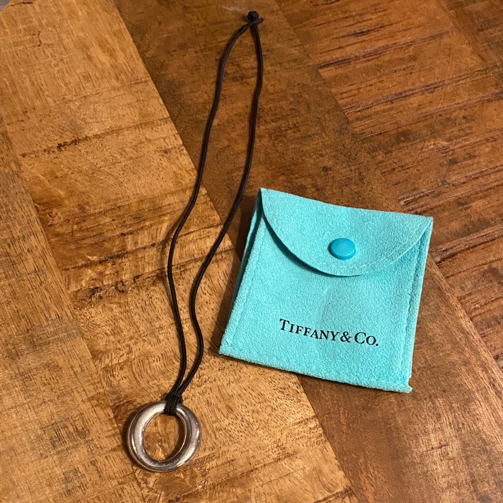 Tiffany & Co. Silver Pendant on Black Silk.